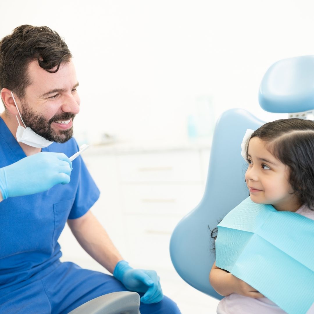 dentist talking to child