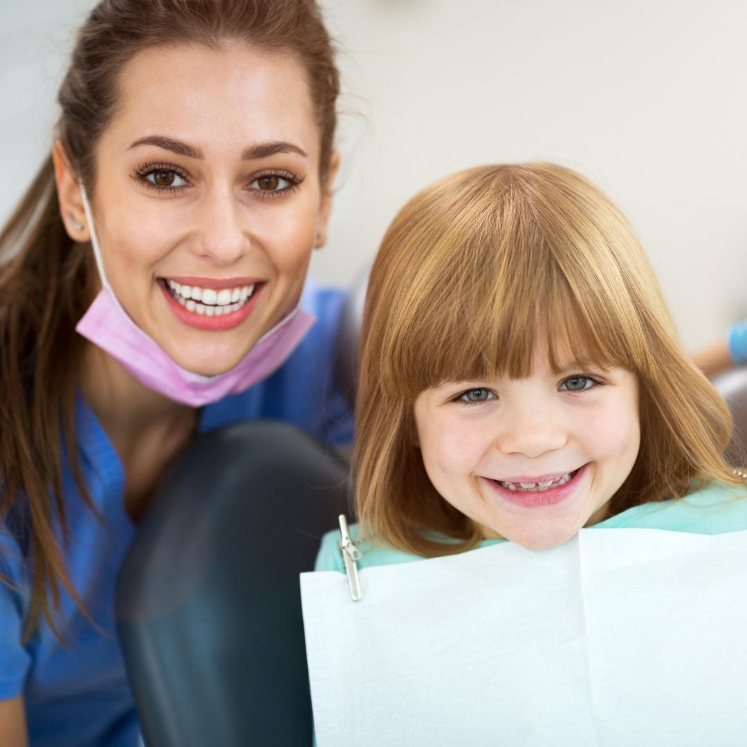child at dentist smiling